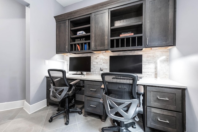 4322 Cannondale Ln, Katy, TX 77450 - office area featuring built in desk, baseboards, and light tile patterned floors