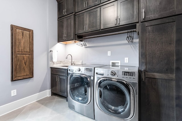 4322 Cannondale Ln, Katy, TX 77450 - laundry room featuring cabinet space, baseboards, washer and dryer, and light tile patterned flooring
