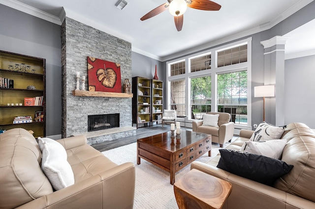 4322 Cannondale Ln, Katy, TX 77450 - living area with a ceiling fan, crown molding, a stone fireplace, and wood finished floors