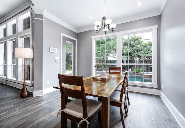 4322 Cannondale Ln, Katy, TX 77450 - dining room featuring dark wood-style flooring, a chandelier, baseboards, recessed lighting, and ornamental molding