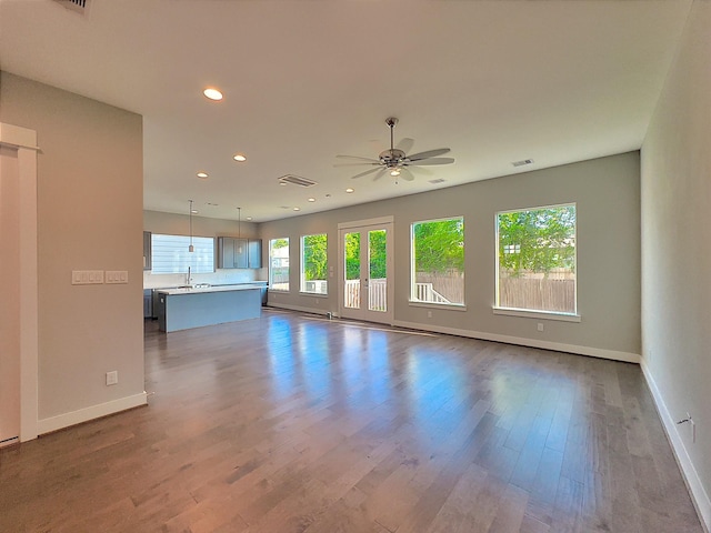 418 Yale Oaks Ln, Houston, TX 77091 - unfurnished living room featuring baseboards, ceiling fan, dark wood-style floors, recessed lighting, and a sink