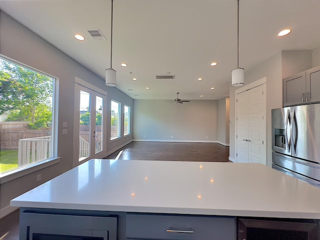 418 Yale Oaks Ln, Houston, TX 77091 - kitchen featuring stainless steel fridge with ice dispenser, recessed lighting, gray cabinetry, a ceiling fan, and a kitchen island