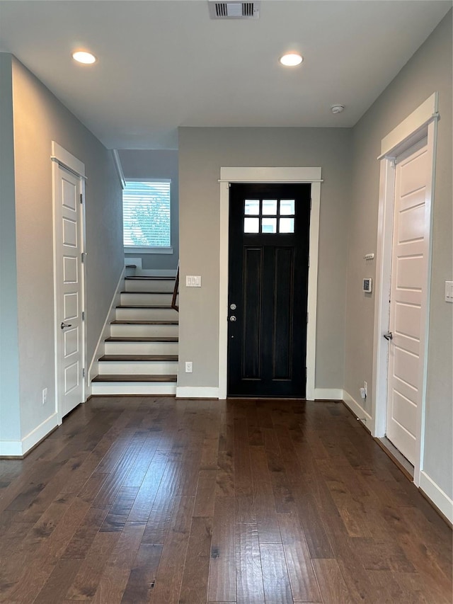 418 Yale Oaks Ln, Houston, TX 77091 - entrance foyer featuring dark wood-style floors, stairs, baseboards, and recessed lighting