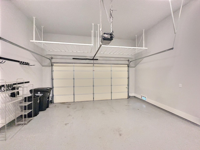 418 Yale Oaks Ln, Houston, TX 77091 - garage featuring a garage door opener and baseboards