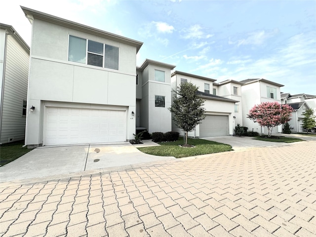 418 Yale Oaks Ln, Houston, TX 77091 - multi unit property with concrete driveway, stucco siding, and a garage