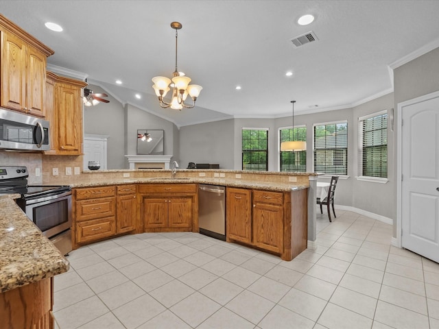 12008 7th St, Santa Fe, TX 77510 - kitchen featuring stainless steel appliances, a sink, ornamental molding, ceiling fan, and a chandelier