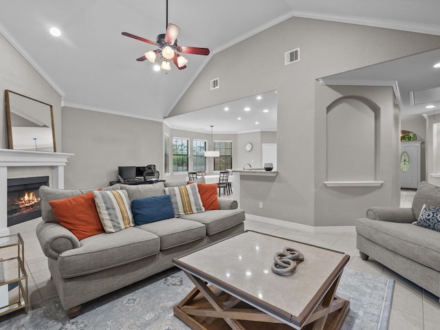 12008 7th St, Santa Fe, TX 77510 - tiled living room with lofted ceiling, a ceiling fan, crown molding, a tile fireplace, and recessed lighting