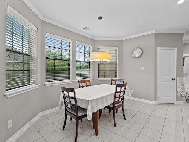 12008 7th St, Santa Fe, TX 77510 - dining space with crown molding, baseboards, and light tile patterned flooring