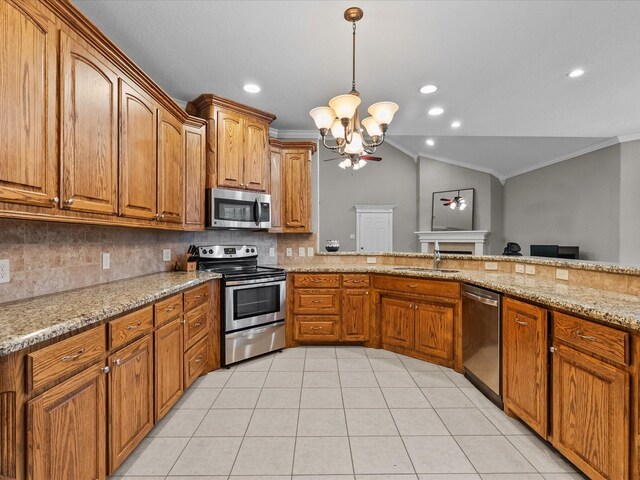 12008 7th St, Santa Fe, TX 77510 - kitchen featuring appliances with stainless steel finishes, a sink, a chandelier, brown cabinetry, and crown molding