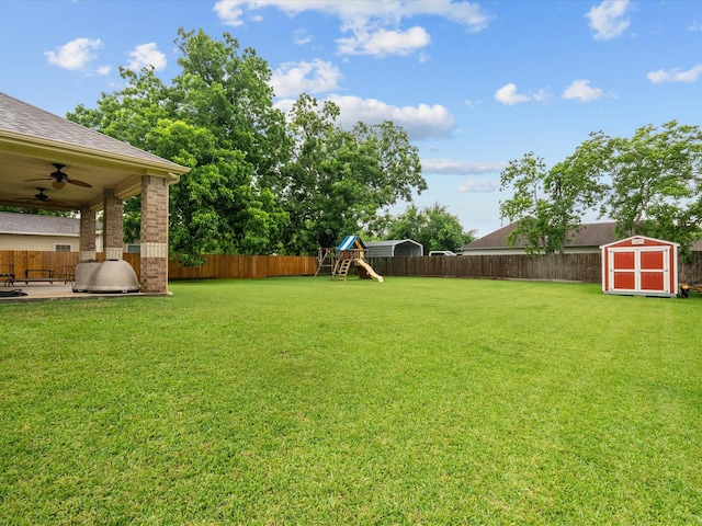 12008 7th St, Santa Fe, TX 77510 - view of yard featuring a playground, ceiling fan, and a patio area