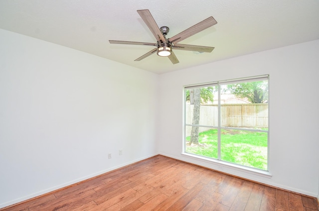 7919 Clarion Way, Houston, TX 77040 - spare room with light wood-style flooring, baseboards, and ceiling fan