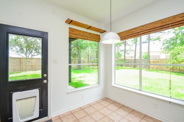 7919 Clarion Way, Houston, TX 77040 - unfurnished dining area with plenty of natural light, heating unit, baseboards, and light tile patterned floors