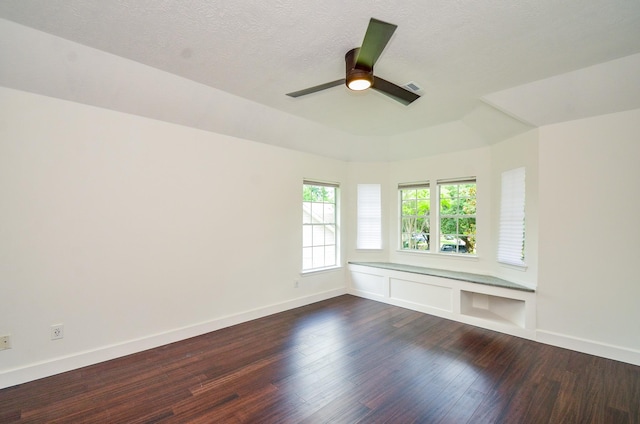 7919 Clarion Way, Houston, TX 77040 - spare room with dark wood-style floors, baseboards, ceiling fan, and a textured ceiling