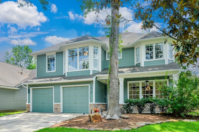 7919 Clarion Way, Houston, TX 77040 - view of front of home featuring an attached garage, driveway, stone siding, and a shingled roof