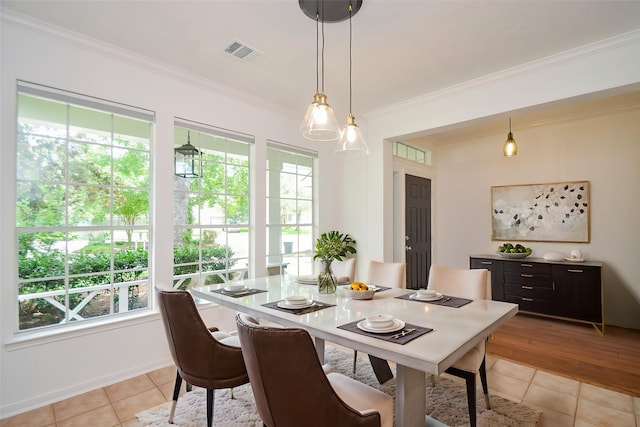 7919 Clarion Way, Houston, TX 77040 - dining area with plenty of natural light, ornamental molding, light tile patterned floors, and baseboards