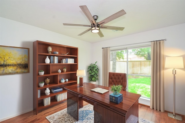 7919 Clarion Way, Houston, TX 77040 - home office featuring light wood-style floors, a ceiling fan, and baseboards