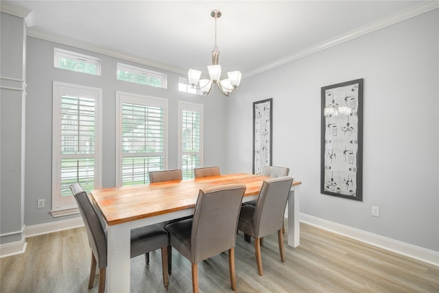 14130 Glasgow Pl, Houston, TX 77077 - dining space with crown molding, a chandelier, light wood-type flooring, healthy amount of natural light, and baseboards