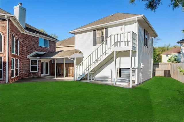 14130 Glasgow Pl, Houston, TX 77077 - rear view of house with stairs, a patio, a shingled roof, and a chimney