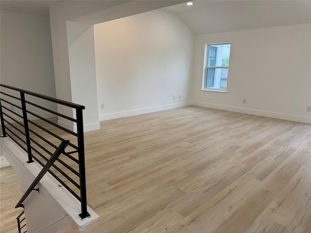 5005 Chestnut St, Bellaire, TX 77401 - spare room featuring vaulted ceiling, baseboards, light wood-type flooring, and recessed lighting