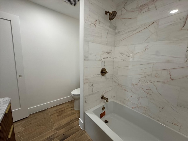 5005 Chestnut St, Bellaire, TX 77401 - bathroom with toilet, shower / tub combination, wood finished floors, vanity, and baseboards