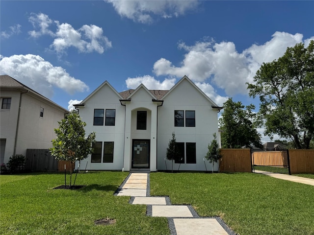 5005 Chestnut St, Bellaire, TX 77401 - view of front of property featuring stucco siding and a gate