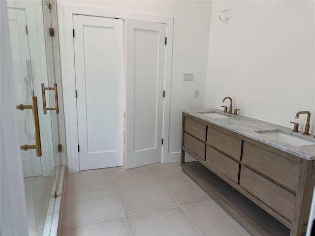 5005 Chestnut St, Bellaire, TX 77401 - full bath featuring a stall shower, tile patterned floors, and double vanity