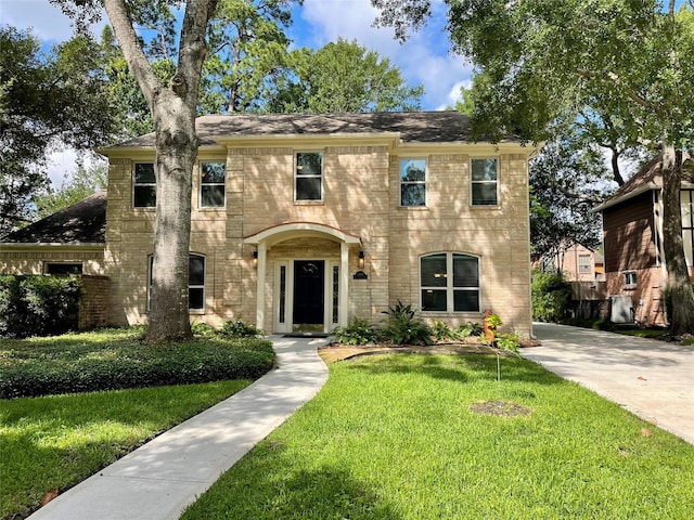 16907 Misty Creek Dr, Spring, TX 77379 - colonial house with a front yard and brick siding