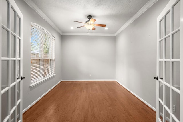 16907 Misty Creek Dr, Spring, TX 77379 - unfurnished room featuring french doors, a ceiling fan, wood finished floors, ornamental molding, and baseboards