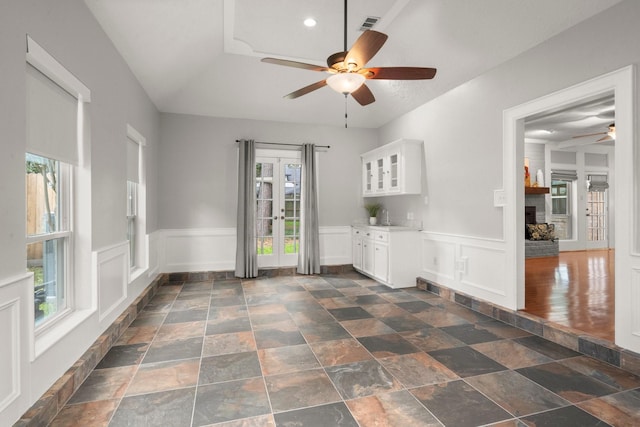 16907 Misty Creek Dr, Spring, TX 77379 - spare room featuring a ceiling fan, a wainscoted wall, dark stone finish floors, a decorative wall, and recessed lighting