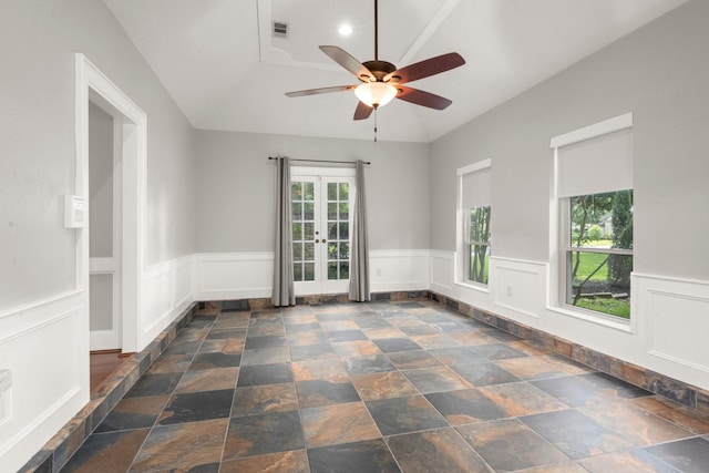 16907 Misty Creek Dr, Spring, TX 77379 - spare room featuring healthy amount of natural light, french doors, a ceiling fan, lofted ceiling, and stone finish flooring