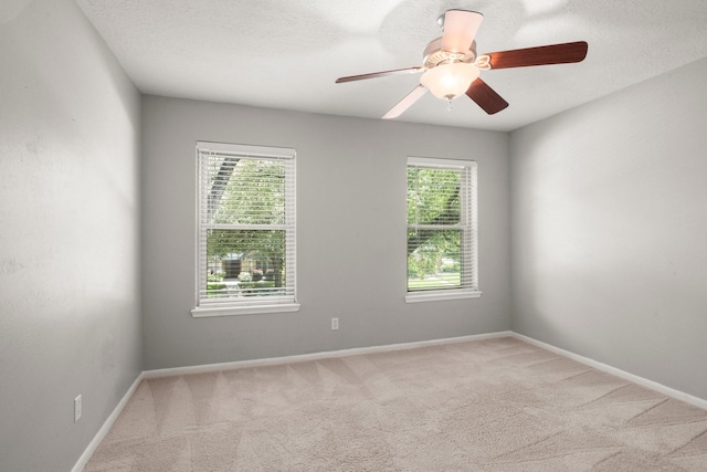 16907 Misty Creek Dr, Spring, TX 77379 - carpeted empty room featuring healthy amount of natural light, baseboards, and a ceiling fan