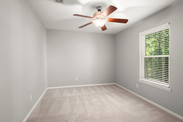 16907 Misty Creek Dr, Spring, TX 77379 - spare room with light colored carpet, ceiling fan, and baseboards