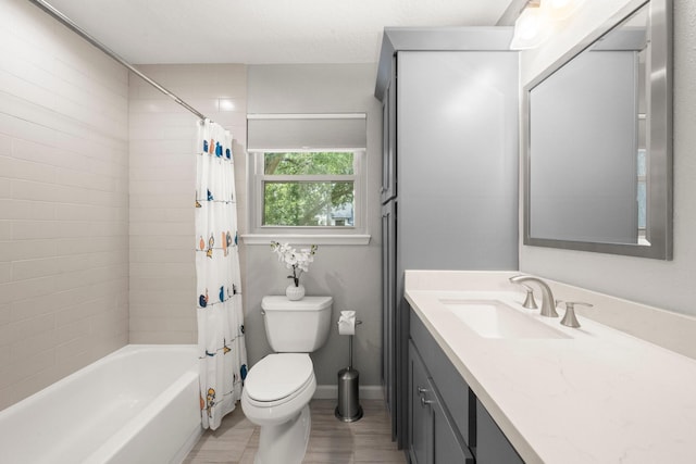 16907 Misty Creek Dr, Spring, TX 77379 - full bathroom with vanity, toilet, shower / bathtub combination with curtain, and baseboards