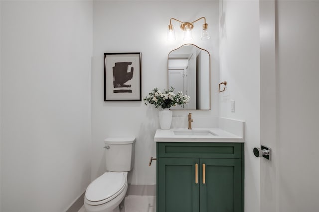 1724 Ridgewood St, Houston, TX 77006 - half bathroom with toilet, vanity, and baseboards