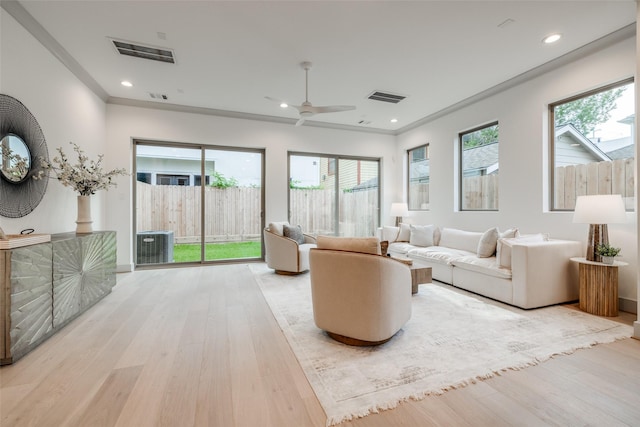 1724 Ridgewood St, Houston, TX 77006 - living area with wood finished floors, ceiling fan, recessed lighting, and crown molding