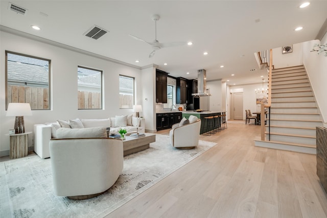 1724 Ridgewood St, Houston, TX 77006 - living area with stairs, light wood-style floors, recessed lighting, and a ceiling fan