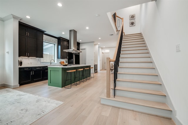 1724 Ridgewood St, Houston, TX 77006 - stairway featuring recessed lighting, wood finished floors, ornamental molding, and baseboards