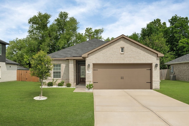 7315 Parkview Dr, Hitchcock, TX 77563 - view of front facade with brick siding, an attached garage, driveway, and central AC