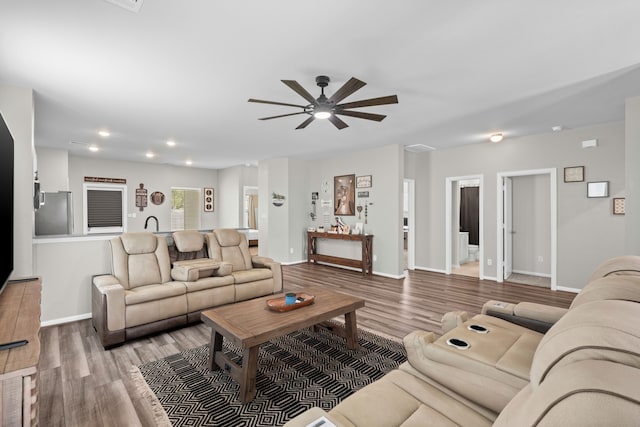 7315 Parkview Dr, Hitchcock, TX 77563 - living room featuring ceiling fan, wood finished floors, baseboards, and recessed lighting