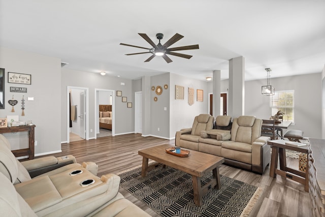 7315 Parkview Dr, Hitchcock, TX 77563 - living room with ceiling fan, wood finished floors, and baseboards