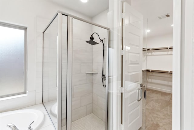 11439 Bush Clover Dr, Cypress, TX 77433 - bathroom with a stall shower, a walk in closet, a garden tub, and recessed lighting