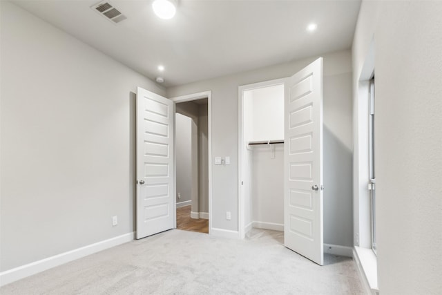 11439 Bush Clover Dr, Cypress, TX 77433 - unfurnished bedroom featuring light carpet, baseboards, a closet, and recessed lighting