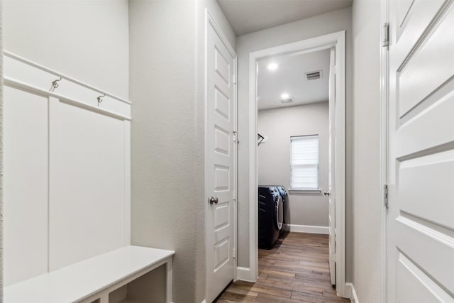 11439 Bush Clover Dr, Cypress, TX 77433 - mudroom featuring independent washer and dryer, dark wood-type flooring, and baseboards