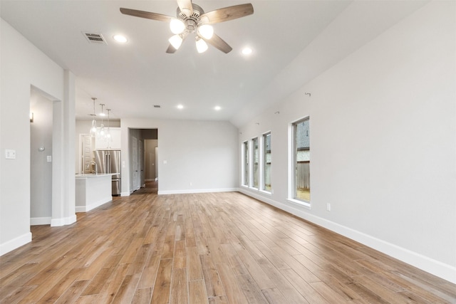 11439 Bush Clover Dr, Cypress, TX 77433 - unfurnished living room featuring light wood-style flooring, a ceiling fan, baseboards, and recessed lighting