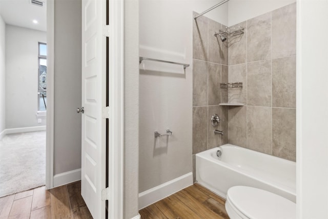 11439 Bush Clover Dr, Cypress, TX 77433 - full bath with toilet, shower / tub combination, wood finished floors, and baseboards