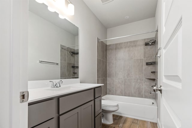 11439 Bush Clover Dr, Cypress, TX 77433 - full bath with vanity, wood finished floors, toilet, and  shower combination