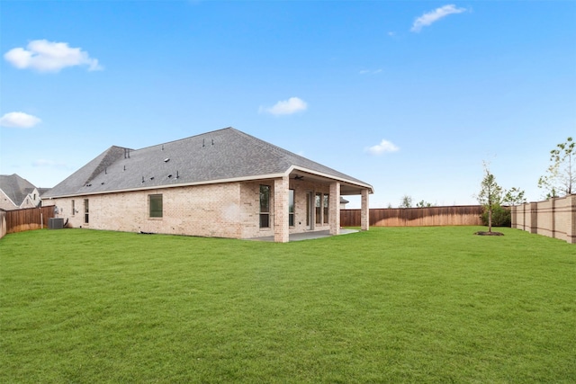11439 Bush Clover Dr, Cypress, TX 77433 - back of house featuring a patio area, central AC unit, ceiling fan, brick siding, and roof with shingles