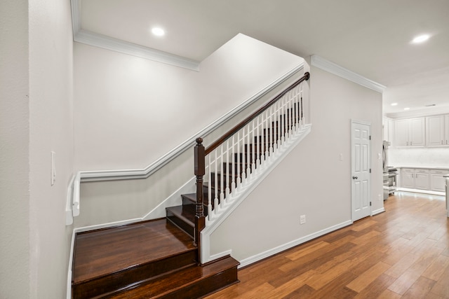 4023 Breakwood Dr, Houston, TX 77025 - stairway with ornamental molding, wood finished floors, recessed lighting, and baseboards