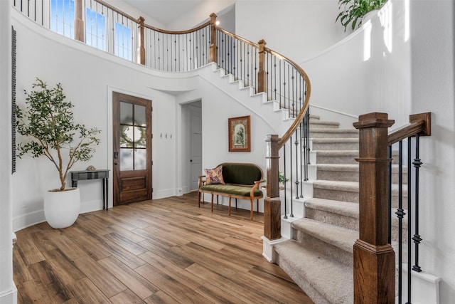 308 Lane Landing Pl, Montgomery, TX 77316 - foyer entrance with stairway, wood finished floors, a high ceiling, healthy amount of natural light, and baseboards