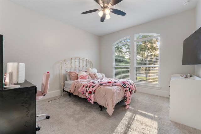 308 Lane Landing Pl, Montgomery, TX 77316 - bedroom with carpet, baseboards, and a ceiling fan